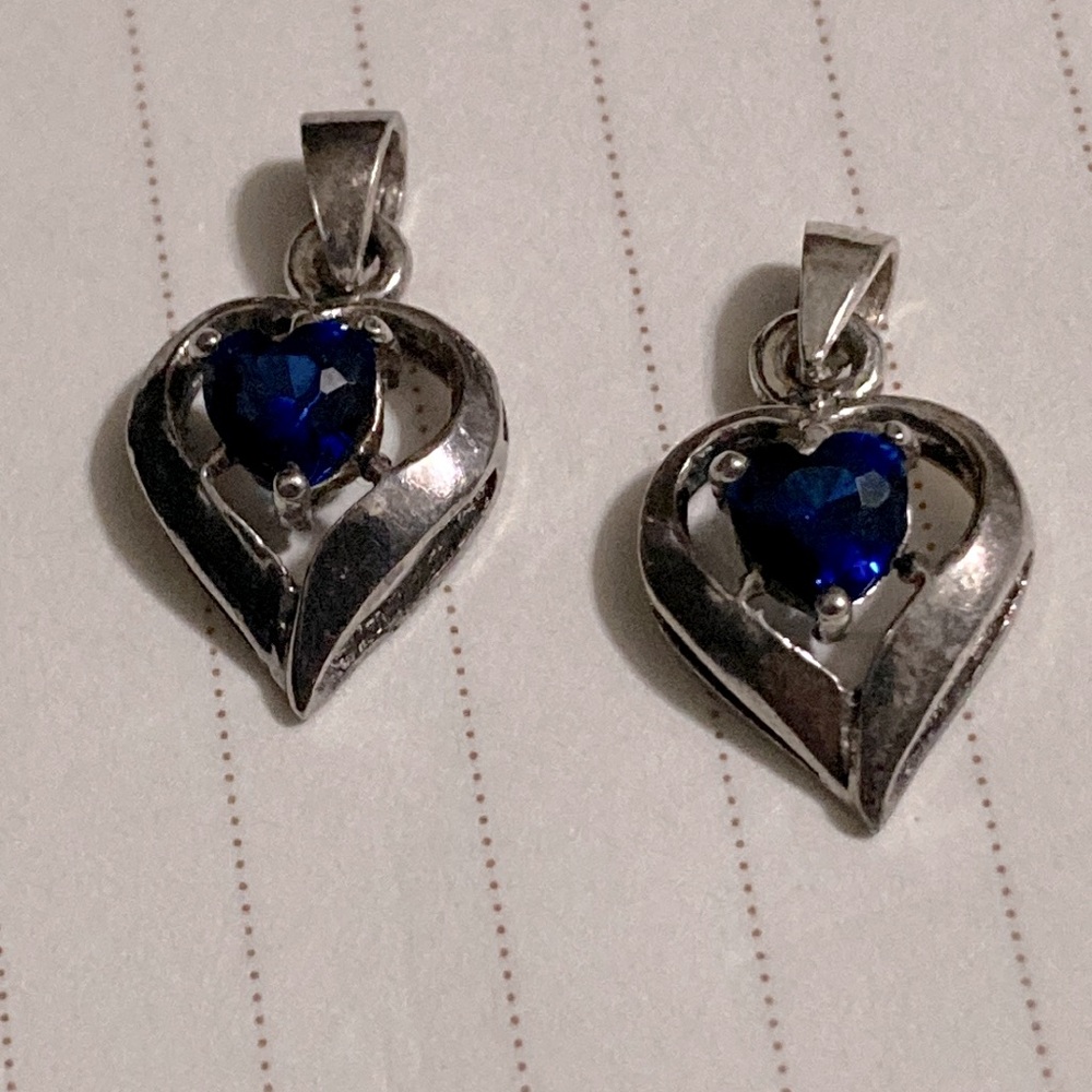 Pair of vintage Sterling heart-shaped pendants with blue gemstones